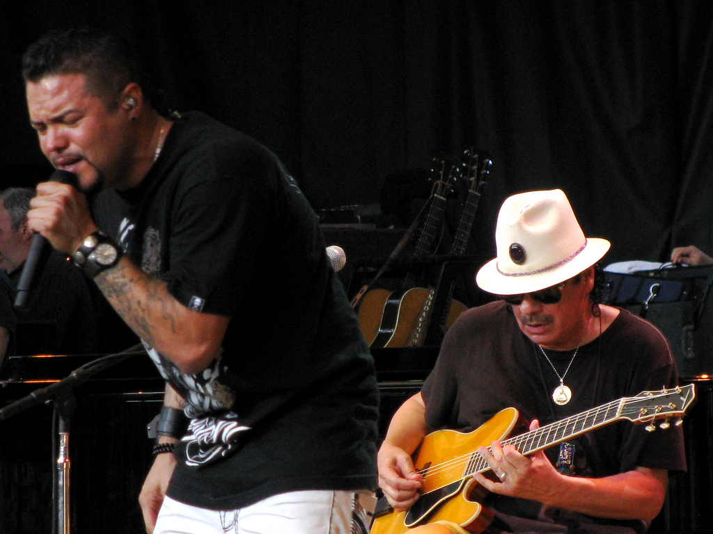 Santana #59. (left to right) Andy Vargas (vo), Carlos Santana (g/perc/vo) Unknown Date